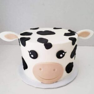 Playful Spotted Cow Character Cake